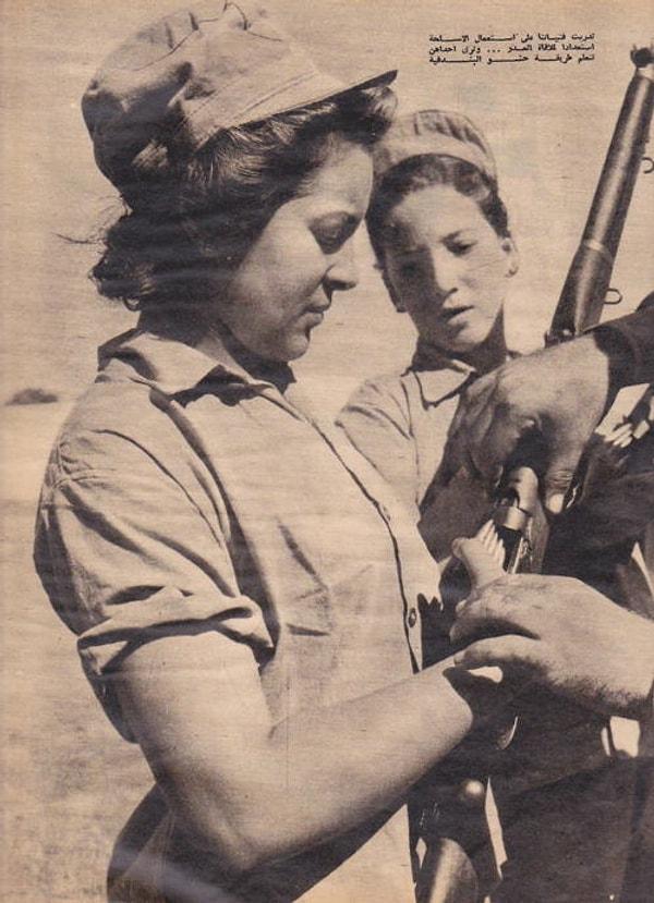 19. Silahını dolduran bir kadın, yıl 1956.
