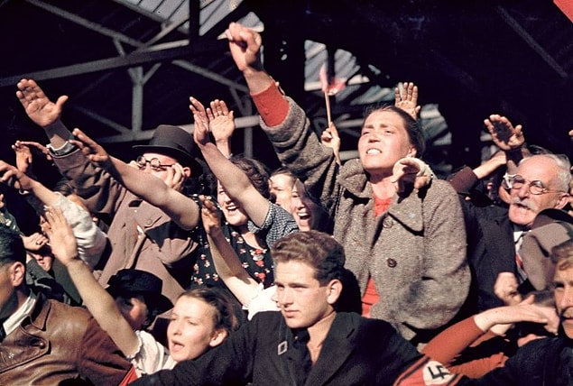 6. Crowds cheering Adolf Hitler’s campaign to unite Austria and Germany, 1938.