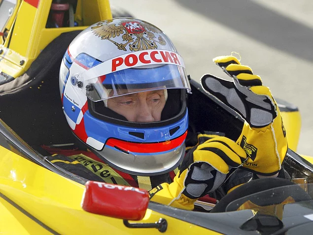Putin likes speed; Here he sits in a car from the Renault Formula One team before test driving it at a racing track in Leningrad Region
