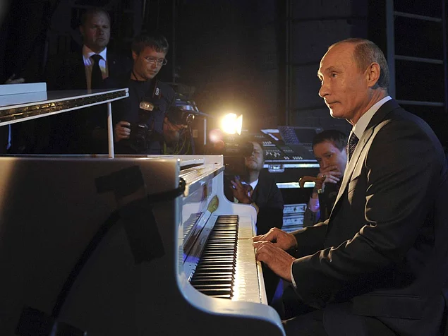 Still, there's a lot more to Putin than shooting animals with tranquilizer guns while shirtless. He also plays piano.