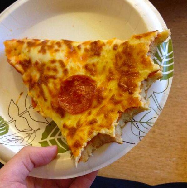 4. Eating a pizza slice like this is an insult to the pizza