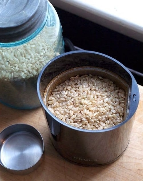 You can use your coffee grinder to shell out the rice!