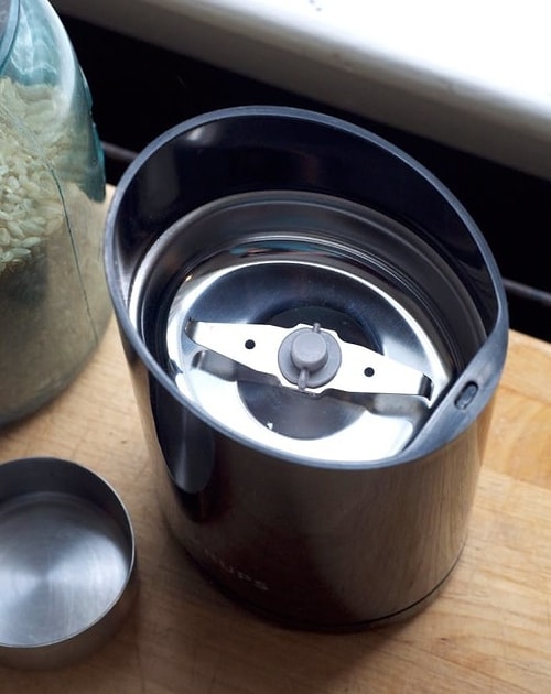 You can use your coffee grinder to shell out the rice!