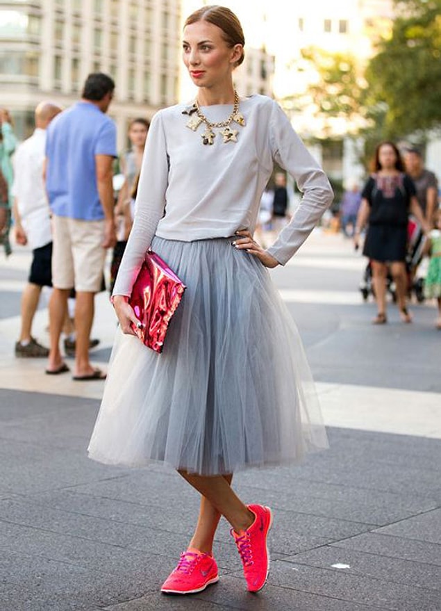 Wearing sneakers with dresses.