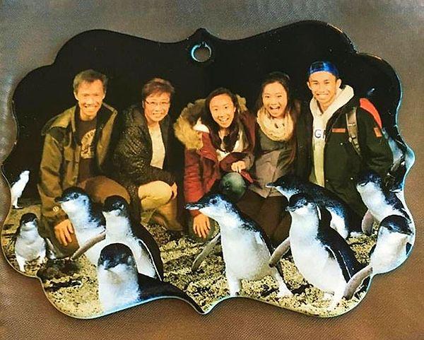 8. "Ordered a custom family photo ornament. Received one with a random Asian family and photoshop added penguins. Not even mad."