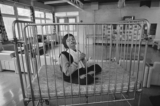 5. A child patient sits inside Normansfield Hospital in Teddington, England on February 12, 1979.
