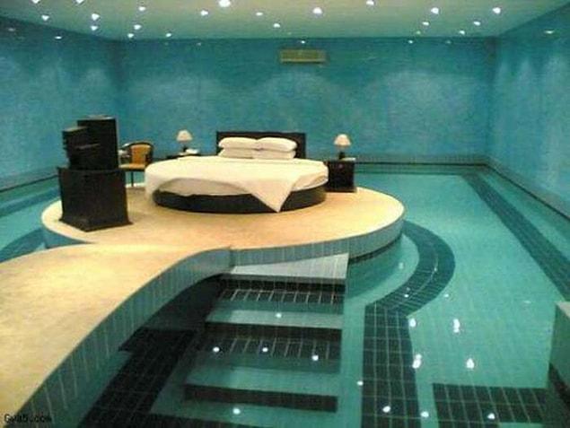 10. Bed at the middle of the swimming pool