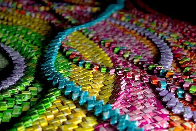 After enough were saved I organized them into colors, ironed them, folded them into links, and made candy wrapper chains.