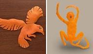 Художник вырезает фигуры животных из мандариновой корки