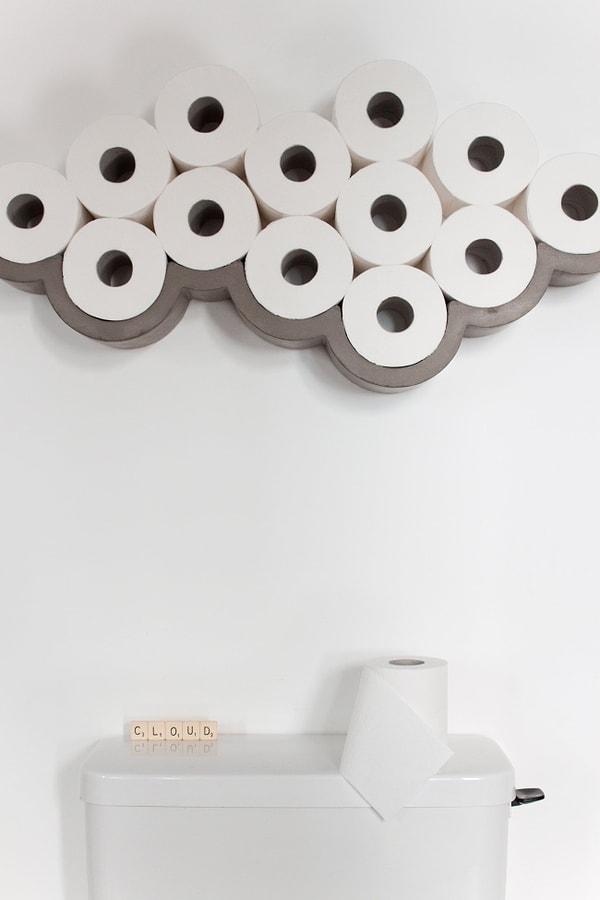 6. Havalı tasarımlardan hoşlanan tembel tenekeler için üretilen bir tuvalet kağıdı rafı.