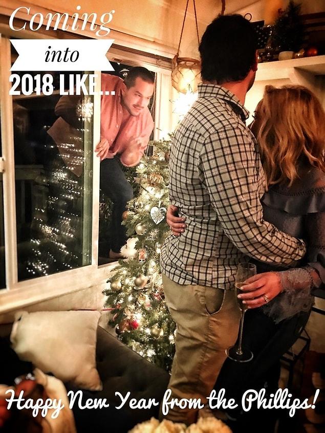 11. “My best friend decided to come through the window right as my wife and I were taking our New Year’s photo... we rolled with it.”