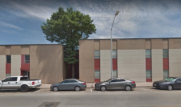 "This lucky tree was spared by a good guy architect who designed an awkward cutout in this building to allow the preexisting tree to keep on living."