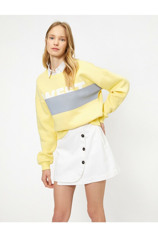 20. Koton marka sarı sweatshirt'ün fiyatı 39 TL'ye düşmüş.