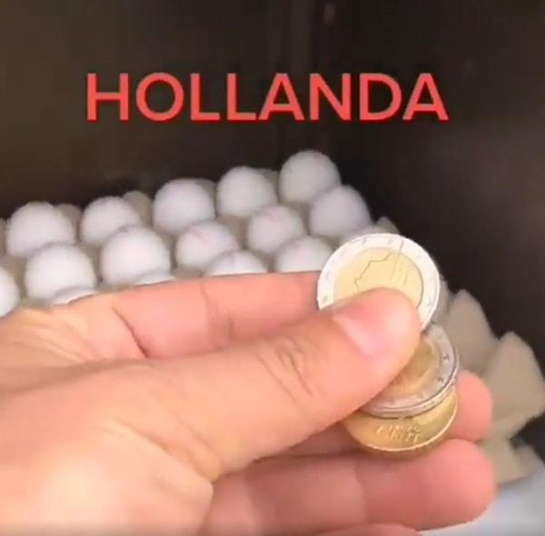 İlker Karlı, 'Bizi kıskanan Hollanda'da da insanlık bitmiş arkadaş...' diyerek paylaştığı görüntülerde, yumurta satın almak için parayı bırakıyor ve yumurtaları alıyor.