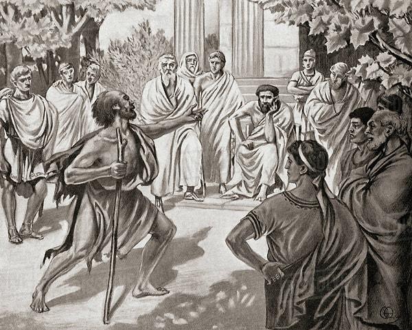 Böylece öğle vakti elinde fenerle "insan arayan" Diyojen, servet düşkünü olduklarını düşündüğü için Atina halkını kıyasıya eleştirmeye başlar.