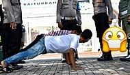 Чтобы другим неповадно было: Нарушителей масочного режима в Индонезии заставляют отжиматься и ... лежать в гробу