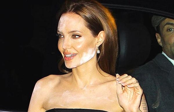 8. Şu fotoğrafta, yapılan makyaj yüzünden acı çeken Angelina Jolie'ye sizin tavsiyeniz ne olurdu?