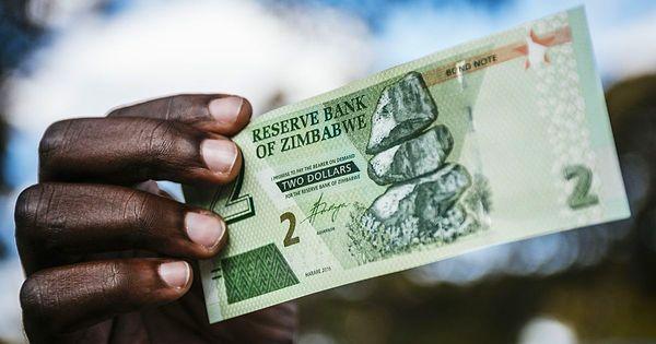Zimbabwe para birimini dolara sabitleyerek enflasyonu düşürdü.