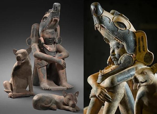 3. Meksika'da bulunan, iki köpeğiyle oturan savaşçının antik heykeli. (M.S 800)