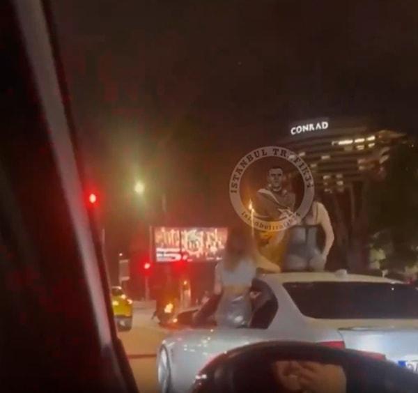 İstanbul Beşiktaş'ta kaydedildiği belirtilen yeni bir görüntüde, bir kadının aracın sunroof'undan çıkarak twerk yaptığı anlar görülüyor.