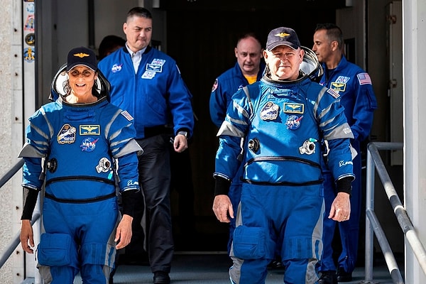 The astronauts, who were assisting other crew members at the International Space Station, expressed their belief that they would return to Earth someday.