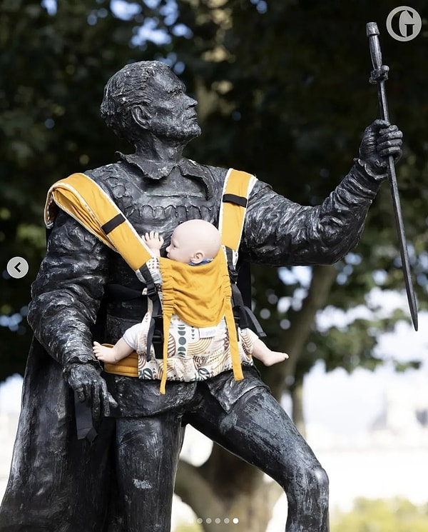 Toy babies have been tied to the arms of famous male statues across the country.