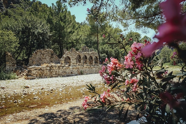 A walk through Olympos feels like stepping back in time. The ruins are scattered amidst thick vegetation, lending a mysterious, almost otherworldly feel to the site.