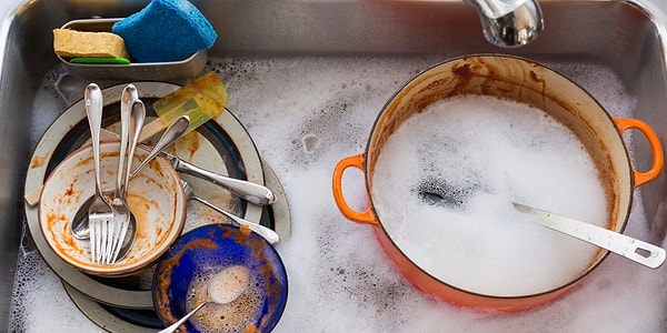 We usually wash the dishes under running water, with plenty of rinsing.