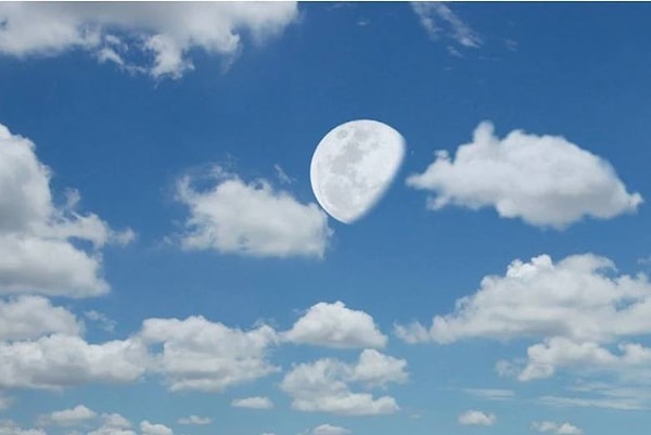 Another reason we are able to see the Moon during the day is due to atmospheric optics.