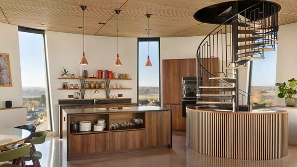 The old water tank has been transformed into a living room and kitchen.