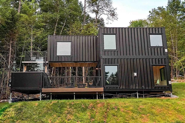 They established a two-story living space from containers.