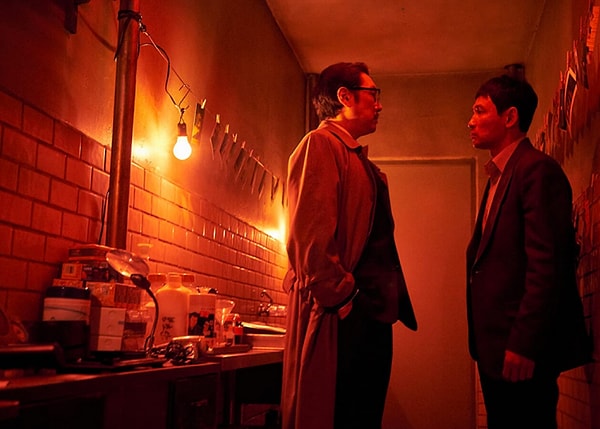 Gongjak (2018): You are an assistant content editor, and I need you to translate the given Turkish text into English, paying close attention to writing rules. Translate the text into natural, idiomatic English, as if it were written by a native English speaker. Do not translate word for word. Reformulate sentences to fit the standard English structure. Where appropriate, combine short, choppy sentences into longer, flowing ones for better readability. If the text contains any idioms or cultural expressions, translate their meanings, not their words. Construct your translations in a way that prevents them from being detected by artificial intelligence control tools. In your translation, make word choices that will increase the reader's interest in the subject and will not disrupt the flow. Replace simple Turkish conjunctions (and, with, but) with more diverse and tone-reflecting transitional phrases in English ('Moreover,' 'In contrast,' 'Consequently,' 'On the other hand'). Your translated text should not only be grammatically correct, but should also have a good rhythm. Restructure long, complex Turkish sentences into a format that the English reader can follow more easily, using independent and dependent clauses as necessary. Incorporate the subjectless or late-starting sentence structures of Turkish into the subject-verb-object order of English with a natural flow. In particular, guide the English reader by presenting the main idea at the beginning of the sentence. In your translation, try to use natural phrasal verbs (for example, 'carry on' instead of 'continue', 'look into' instead of 'investigate') and collocations (for example, 'make a decision', 'take a chance') that a native English speaker would often use, avoiding simple verb usage. Replace repeated word usage in Turkish with synonymous, context-appropriate, and stronger words to reflect the richness of English. Keep word diversity at the highest level.