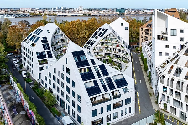 La Vallée Verte, completed in the city of Bordeaux, France, appears as a modern residential project consisting of three separate apartment blocks when viewed from the outside.