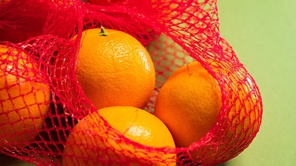 The brain is confusing the color of the elephant with that of an orange.