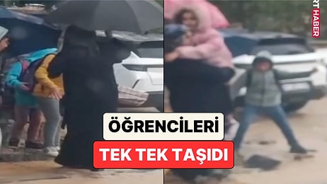Mardin'de Bir Kadın Su Birikintisinden Geçemeyen Öğrencileri Tek Tek Kucağına Alarak Karşıya Geçirdi